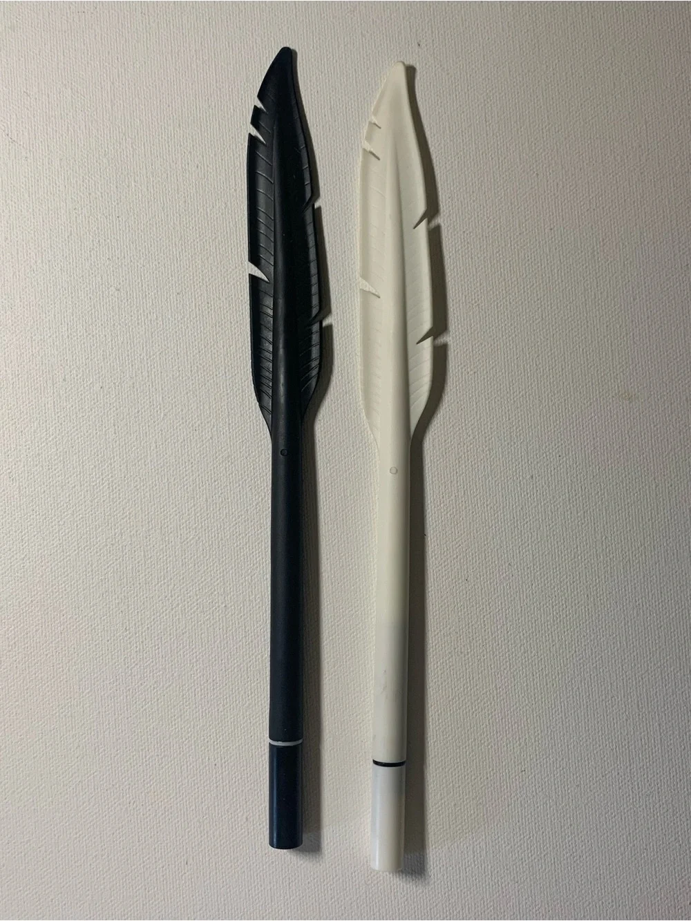 Black and white duo feather pens